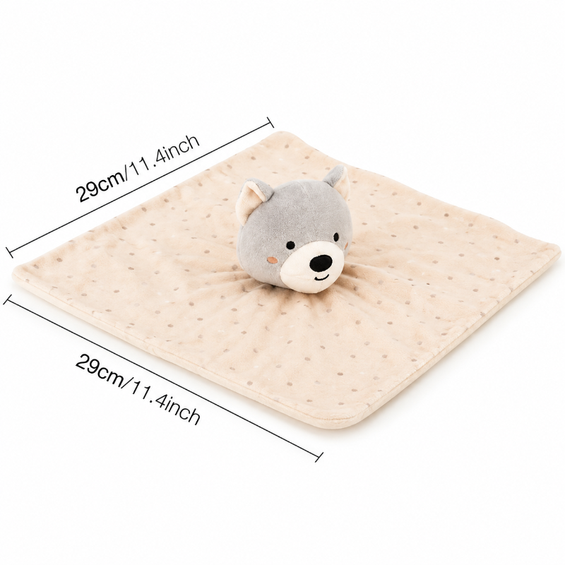 A square beige baby comforter with a gray plush bear head on top, shown on a white background with dimension lines indicating 29cm by 29cm (11.4 inches) on each side.
