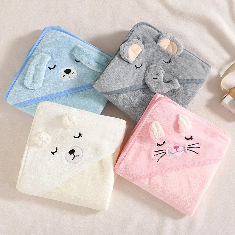 A collection of soft hooded baby towels in blue, gray, white, and pink colors, each with a cute animal face pattern.