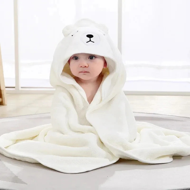 A collection of soft hooded baby towels in blue, gray, white, and pink colors, each with a cute animal face pattern.