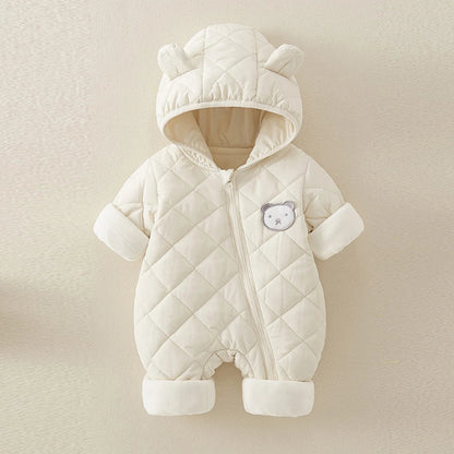 White quilted baby snowsuit with bear ears on a beige background