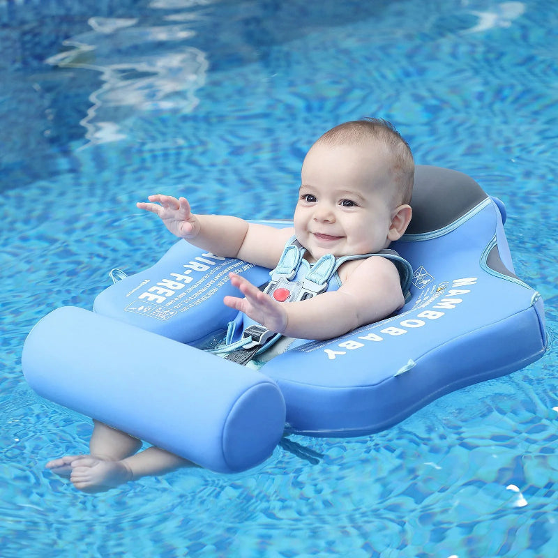 Baby in a blue inflatable swimming ring in a pool