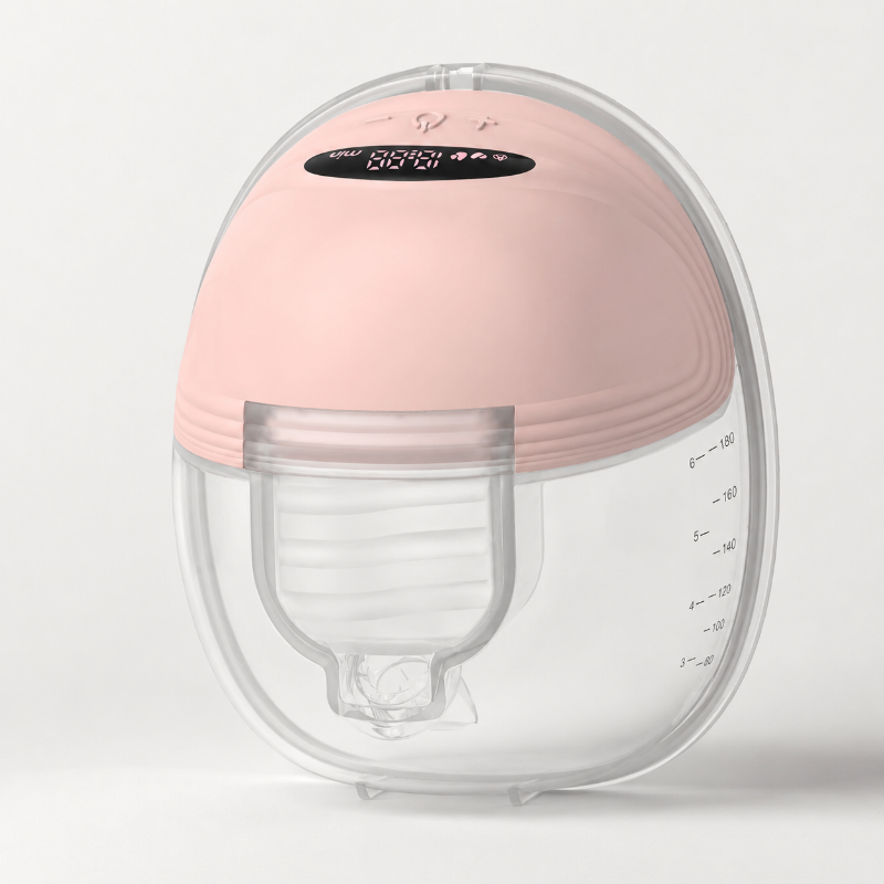 A breast pump or milk collection device with a soft pink silicone top dome and a clear plastic lower chamber, shown on a clean light gray background.