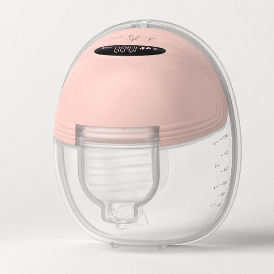 A breast pump or milk collection device with a soft pink silicone top dome and a clear plastic lower chamber, shown on a clean light gray background.
