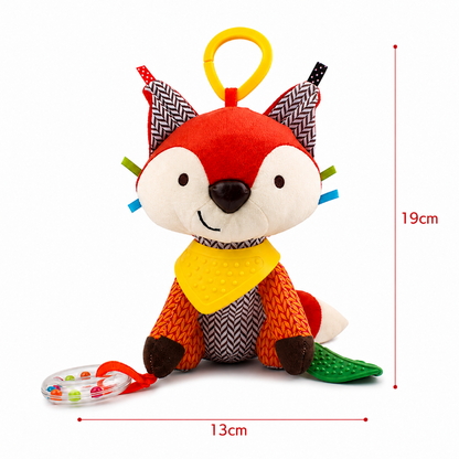 A colorful plush fox baby toy with a yellow hanging loop, patterned ears, a yellow bib, orange body, and a green tail, shown on a white background with red dimension lines indicating 19 cm height and 13 cm width.