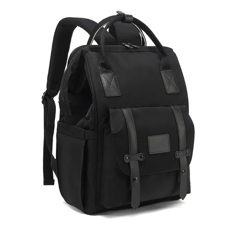A gray waterproof nappy backpack with multiple compartments and shoulder straps, displayed against a white background.