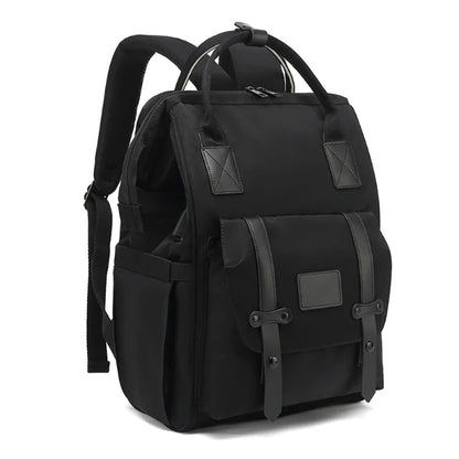 A gray waterproof nappy backpack with multiple compartments and shoulder straps, displayed against a white background.