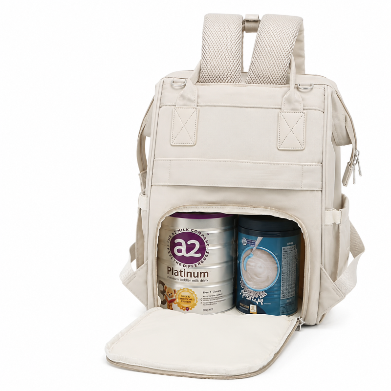 A light beige canvas backpack shown open, with its front pocket pulled down to reveal two large baby formula cans inside. The backpack has padded shoulder straps, side pockets, and a clean white background.