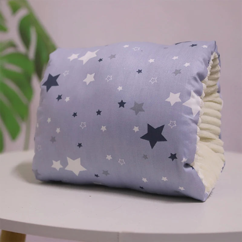 A multicolored nursing arm pillow with a pattern featuring animals and leaves.