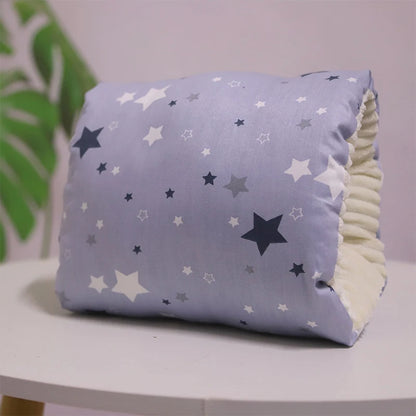 A multicolored nursing arm pillow with a pattern featuring animals and leaves.