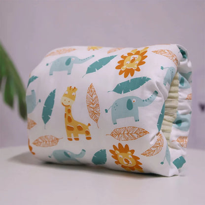 A multicolored nursing arm pillow with a pattern featuring animals and leaves.