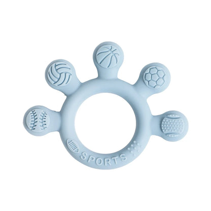Two silicone baby teether rings with various colorful textures, designed to be held by little hands, placed next to a plush toy on a soft surface.