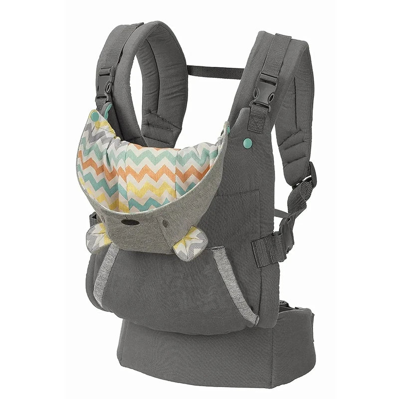 A person is seen wearing a gray ergonomic cotton baby carrier with a geometric pattern, holding a sleeping baby securely inside.