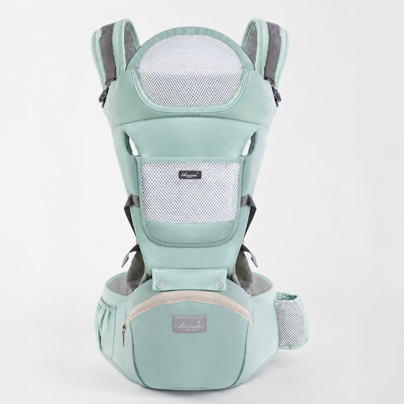 A mint green baby carrier seat belt shown from the back on a light gray background. The carrier features a mint green fabric body with gray mesh back panels, gray shoulder straps, and a beige zipper on the front waist pouch.