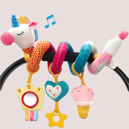 A colorful unicorn-shaped baby stroller hanging toy with multiple soft elements and a mirror included in the design.