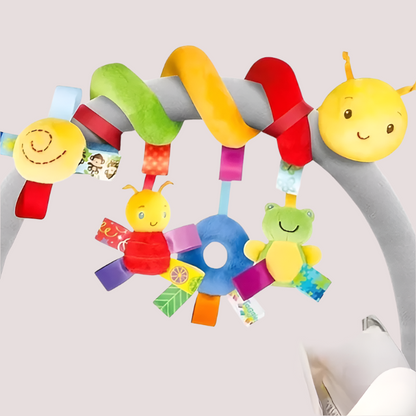 A colorful unicorn-shaped baby stroller hanging toy with multiple soft elements and a mirror included in the design.