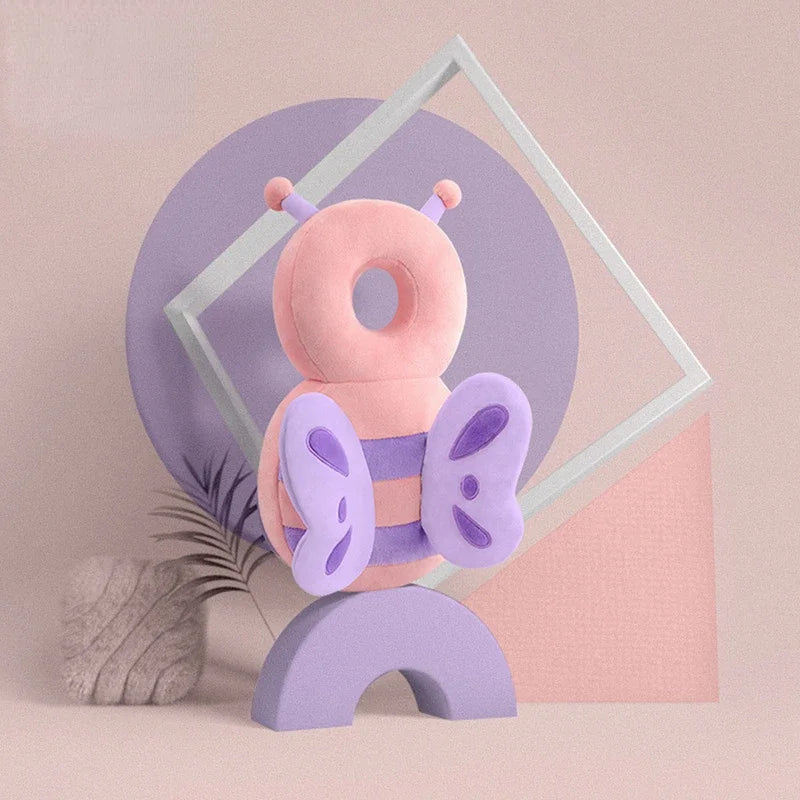 A collection of colorful baby head and back protection pillows with various animal designs displayed against a pastel background.
