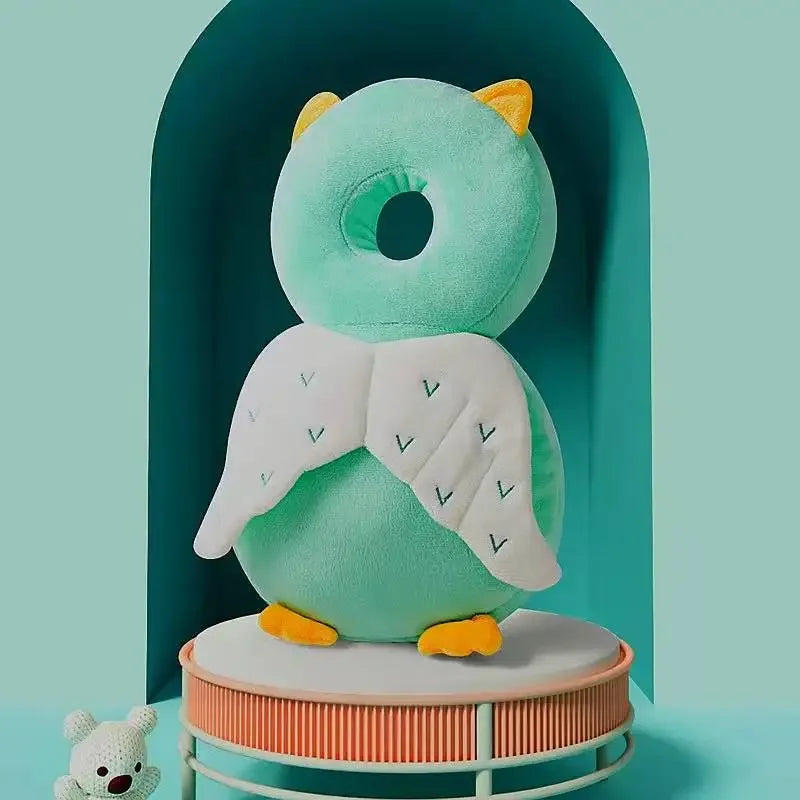 A collection of colorful baby head and back protection pillows with various animal designs displayed against a pastel background.