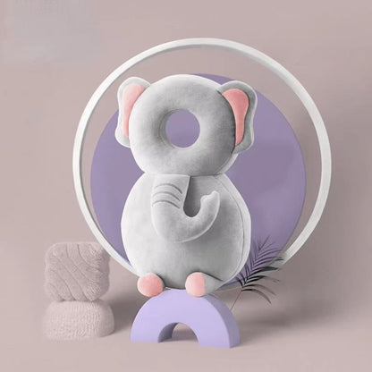 A collection of colorful baby head and back protection pillows with various animal designs displayed against a pastel background.