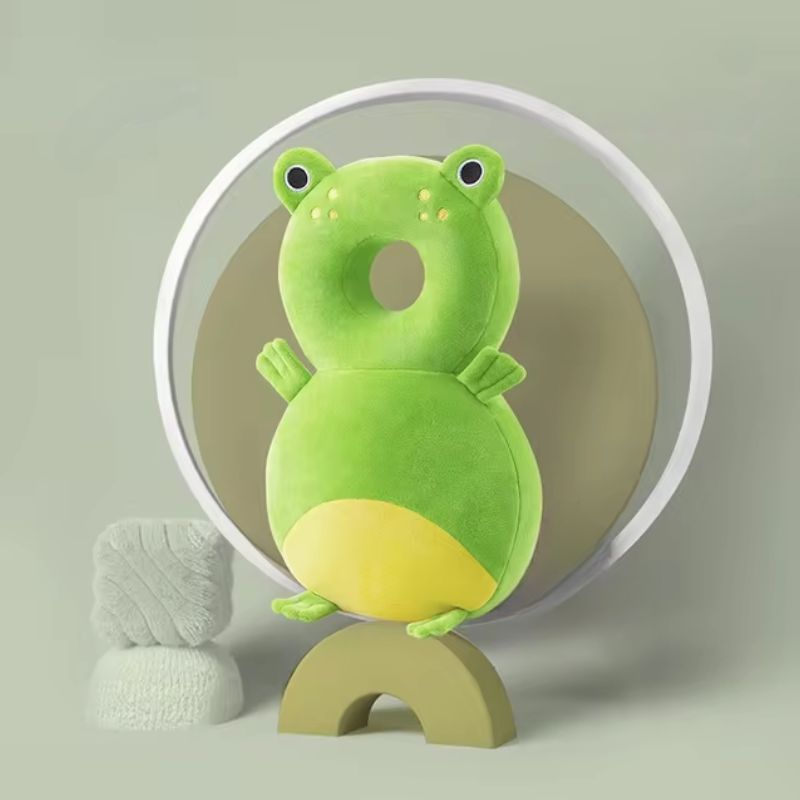 A collection of colorful baby head and back protection pillows with various animal designs displayed against a pastel background.