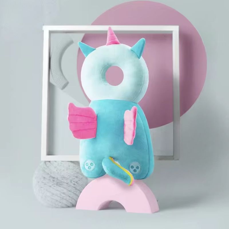 A collection of colorful baby head and back protection pillows with various animal designs displayed against a pastel background.