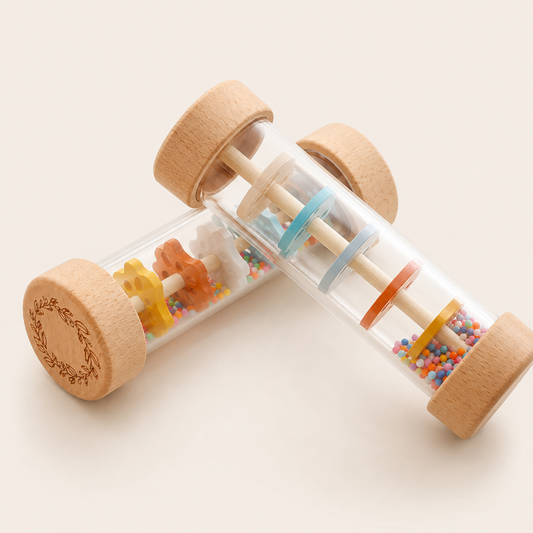 Two wooden rolling sensory toys with clear cylindrical bodies, colorful beads, and animal-shaped wooden pieces, photographed on a clean light beige background.