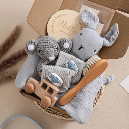 Baby gift set with plush toys, wooden car, and baby items in a basket.