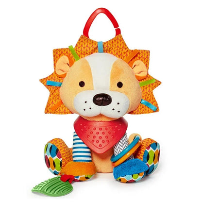 A colorful plush baby toy in the shape of a lion with various textures and a teething ring attached.